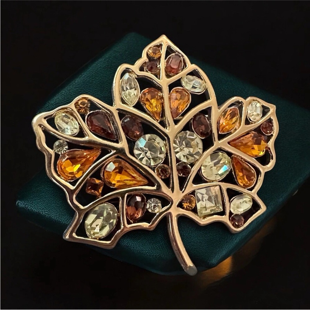 Elegant Gold Leaf Brooch with Multicolor Crystals
